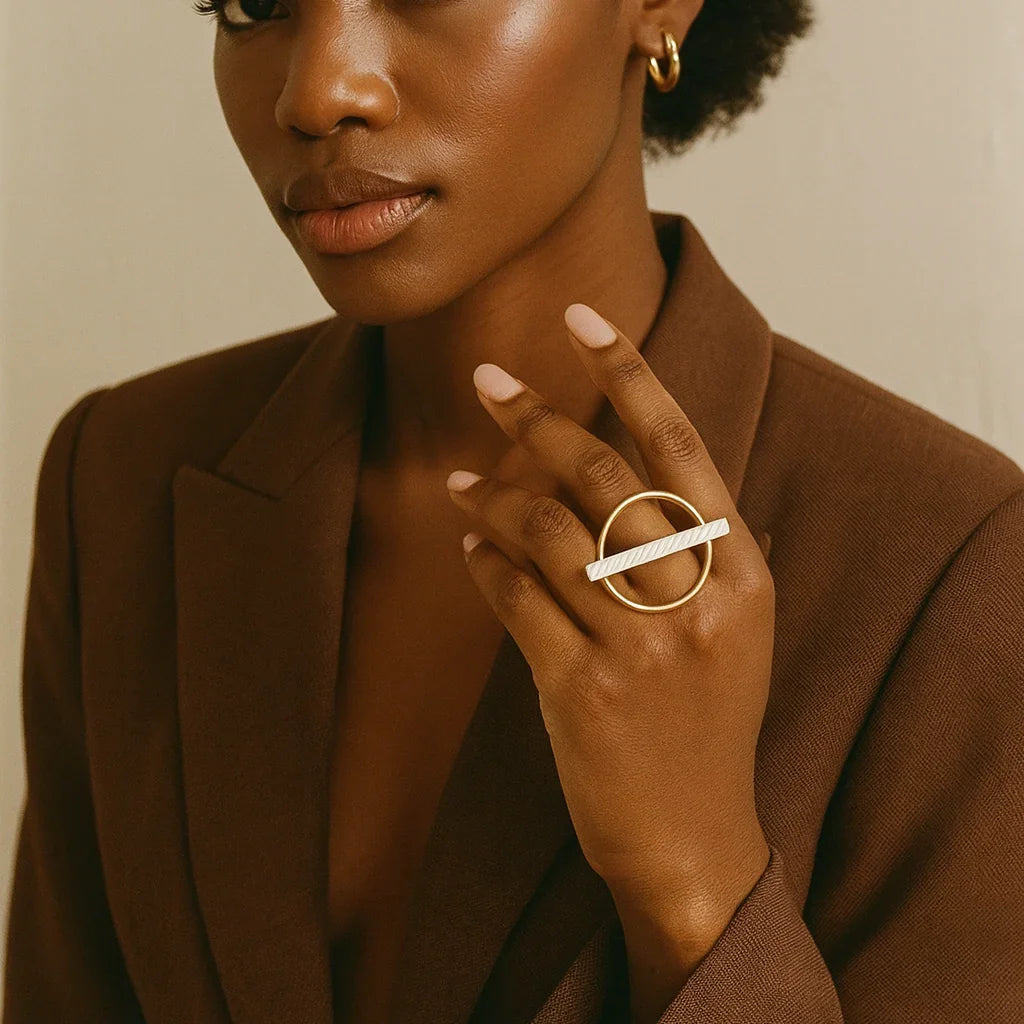 Woman wearing a brown blazer with a neutral background