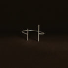 Silver bracelet on a dark brown background