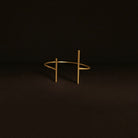 Gold bracelet on a dark background